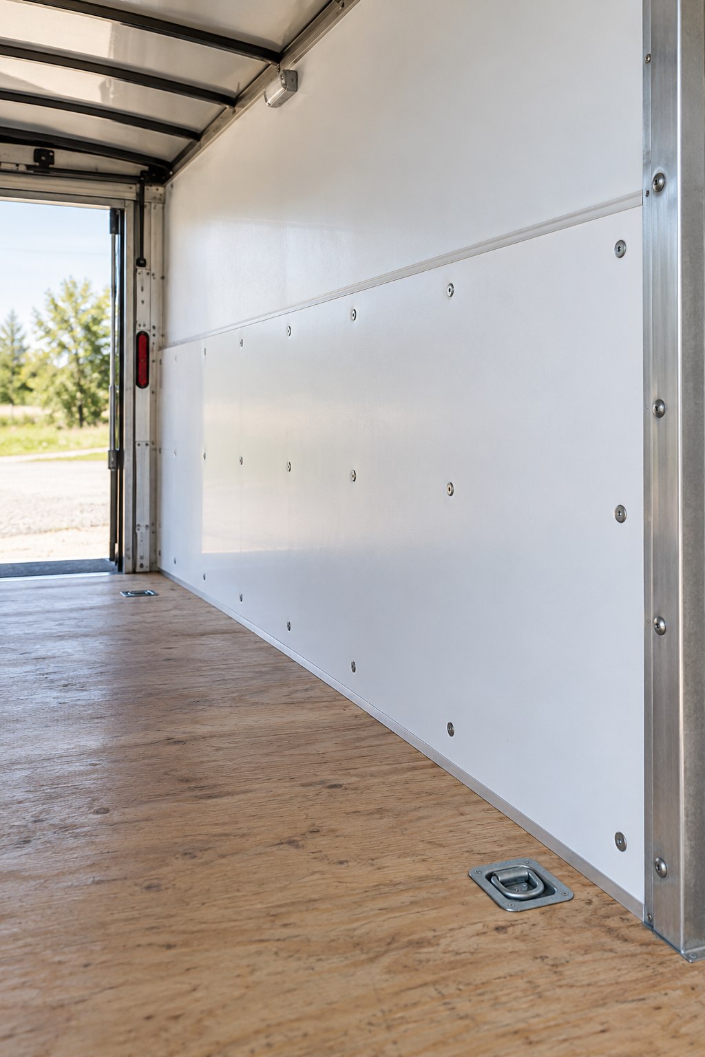 White HDPE puck-board wall liners inside a utility trailer